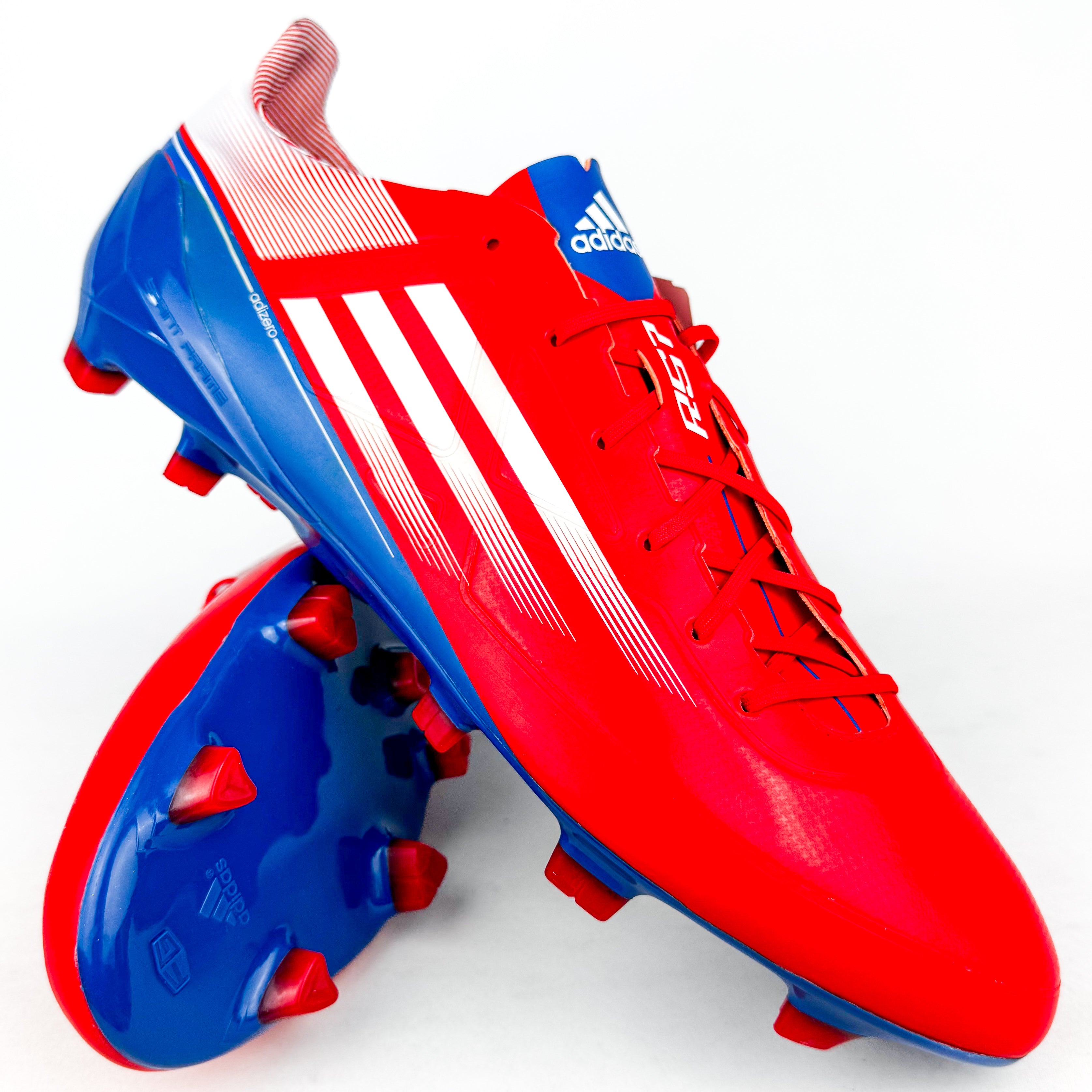 red and blue adidas boots
