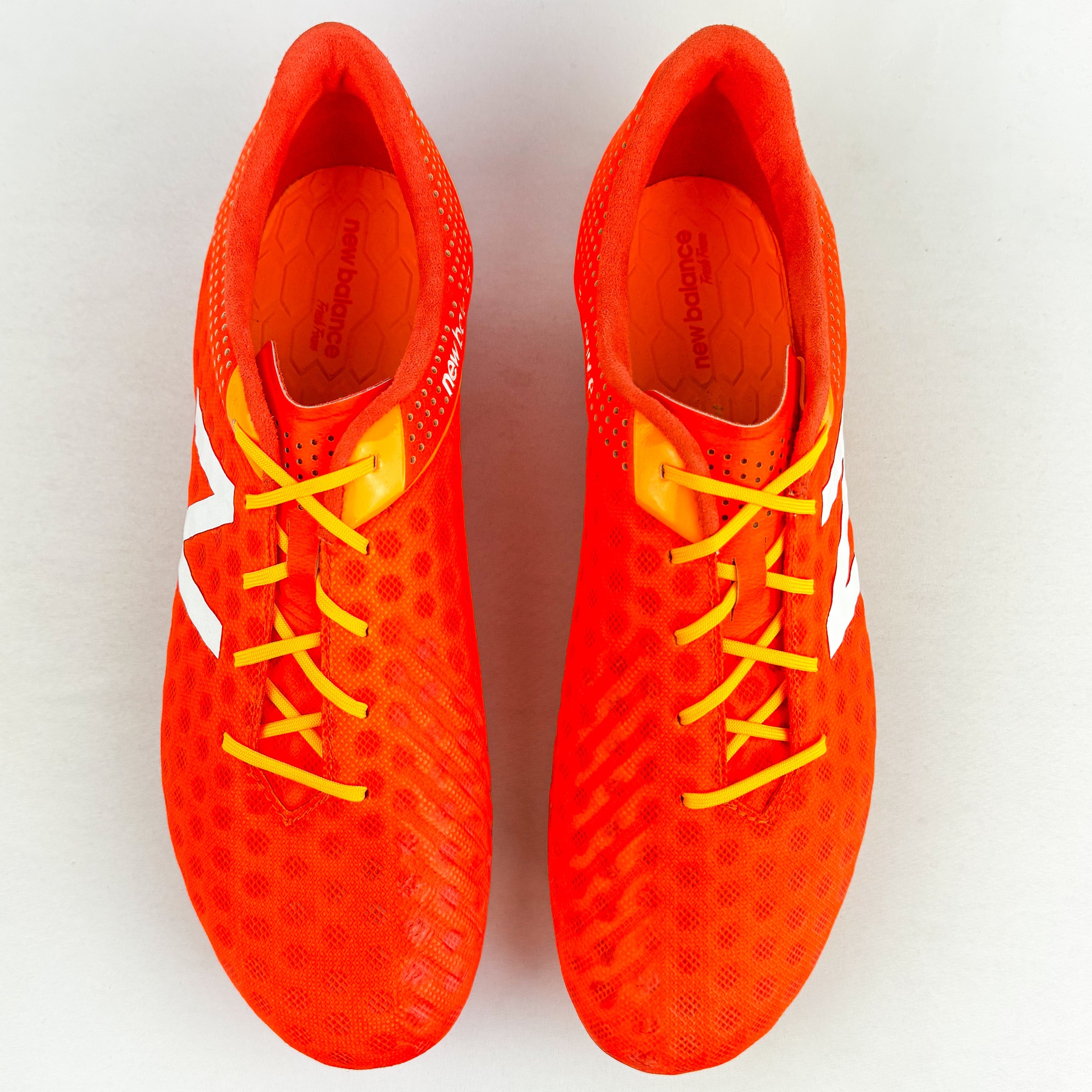 orange new balance football boots